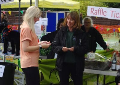 Customer buying raffle tickets at our Summer Open Day